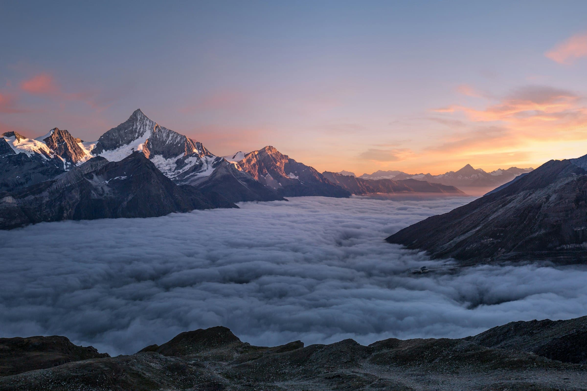 High alpine ridgeline above cloud, a lasting line of stone